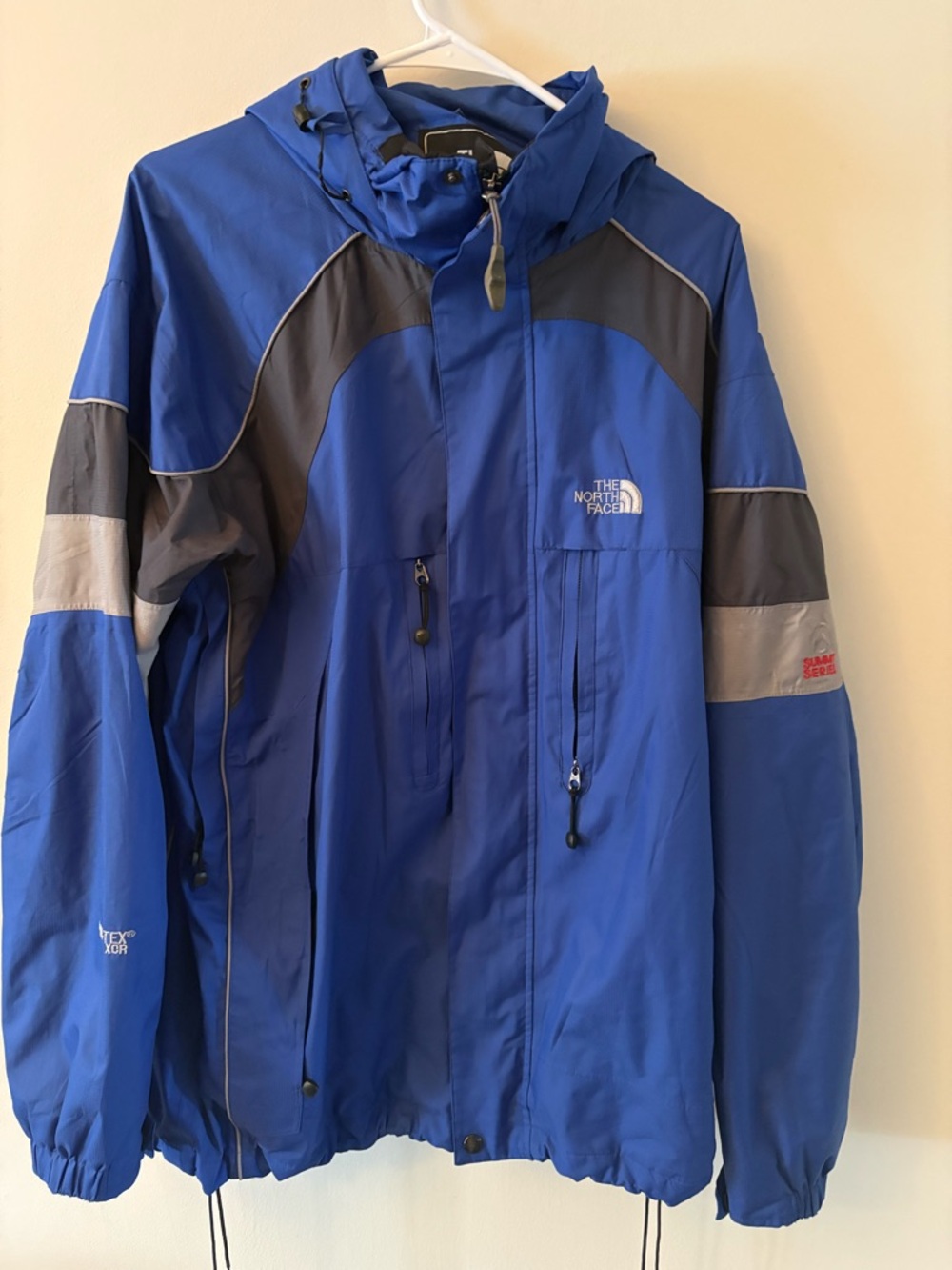 The North Face Men's Blue Hooded Rain Jacket with Gray Accents